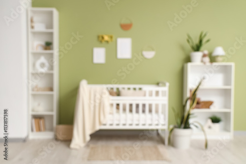 Beautiful crib with plaid and shelving unit near green wall in interior of children's room, blurred view