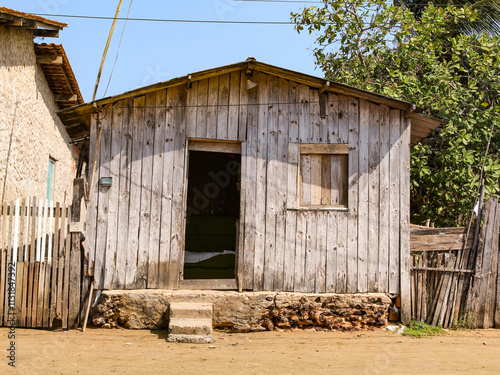 Rustic wooden house, owned by fishermen in the city of Raposa, state of Maranhão, northeast of Brazil, are very common in the Northeast and North of Brazil, South America. photo