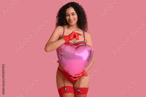 Smiling young woman in red ...