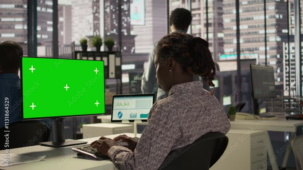 Female analyst reviewing business data on pc next to copy space screen, financial planning and budgeting supports company goals. Effective general management within the enterprise. Camera B.