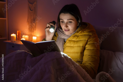 Young woman with flashlight...