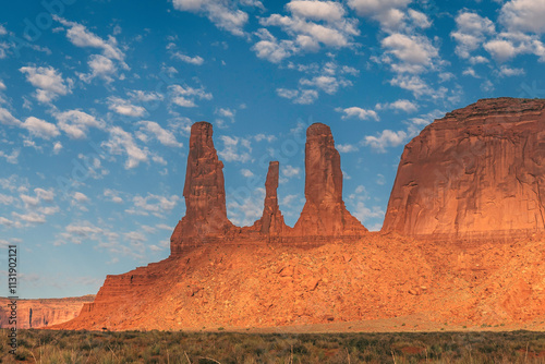 Three Sisters rock formation,, vivid blue sky,  Navajo Park of Monument Valley, Arizona , USA photo