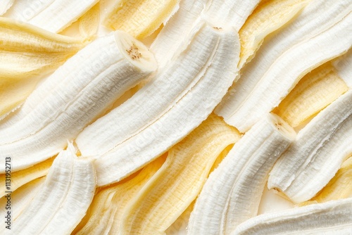 Close-up of sliced, dried bananas, showing creamy white and pale yellow layers. photo