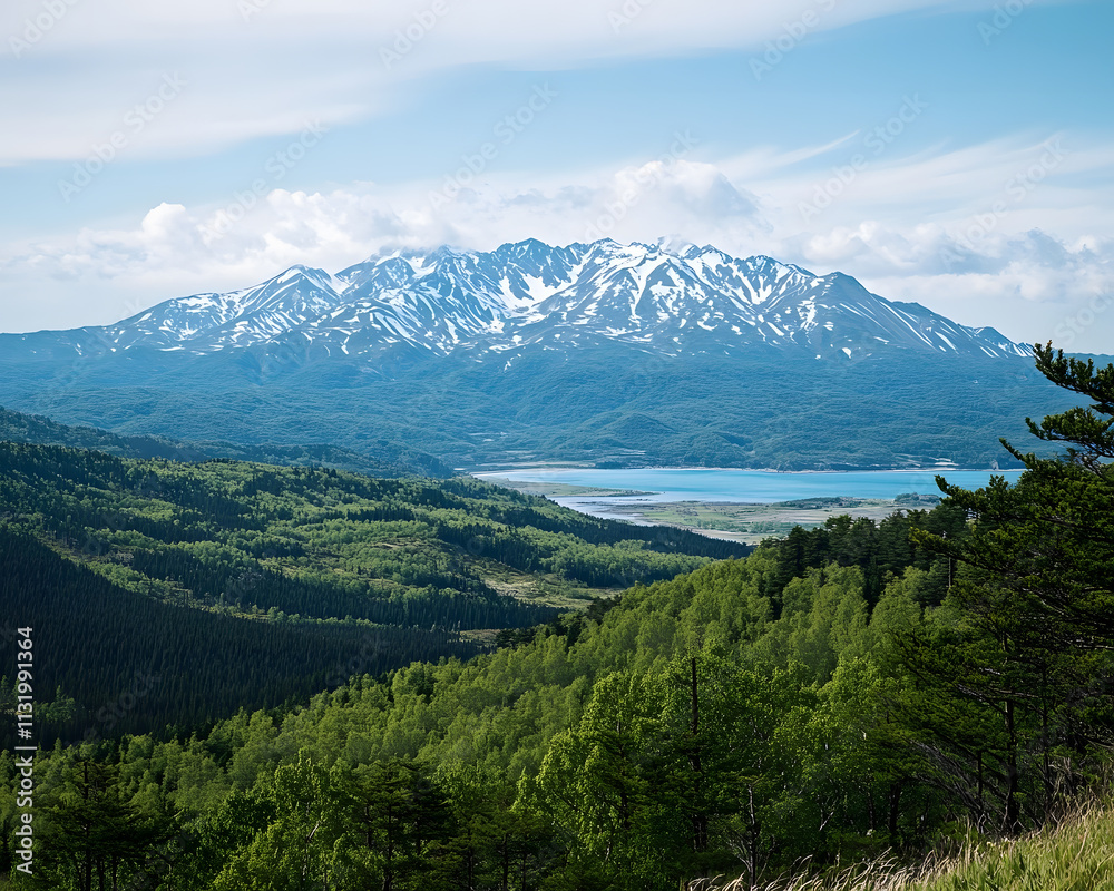 Obraz premium Majestic Snow-capped Mountain Range Overlooking Serene Lake and Lush Green Forest