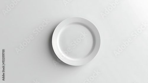 A plain white ceramic plate placed centrally on a smooth white background, highlighting simplicity  photo