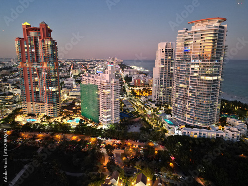 Aerial cityscape. Miami South beach night light. Aerial view on skyscraper cityscape at night. Night city aerial view. Luxury skyscraper in Miami, Florida. Sunset view. City skyline in evening sunset photo