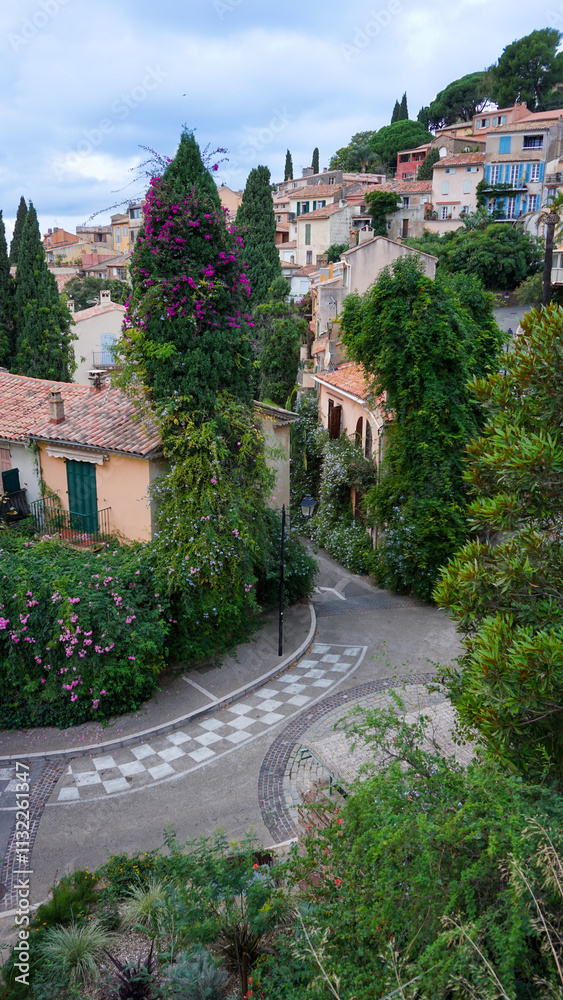 Fototapeta premium Panoramic view of houses and roofs of medieval village of Bormes-les-Mimosas, in the Var, in Provence, France