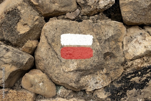 Painted Hiking Trail Marker on Rocky Terrain for Long Distance Routes photo