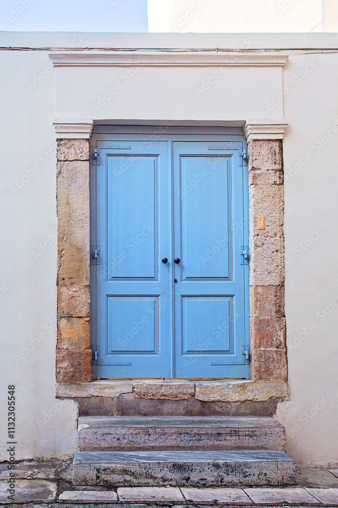 Fototapeta premium Front view Athens house, blue wooden door
