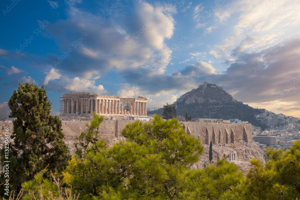 Fototapeta premium Greek Acropolis city of Athens Parthenon symbol of ancient, aerial view. Panorama of residential buildings at sunset summer. World Heritage sites