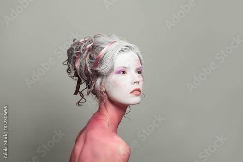 Woman with white face and creative hairstyle, fashion beauty portrait