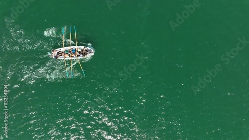 Aerial top down view of boat team rowing. Team sport concept
