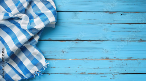 Blue and white checkered cloth on a rustic wooden table with a bright blue background inviting casual dining and gatherings. Generative AI