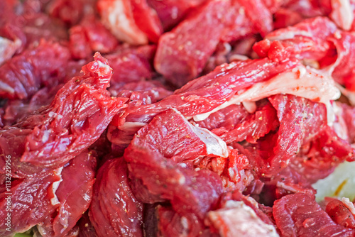 abstract background of raw fresh meat cut into pieces photo