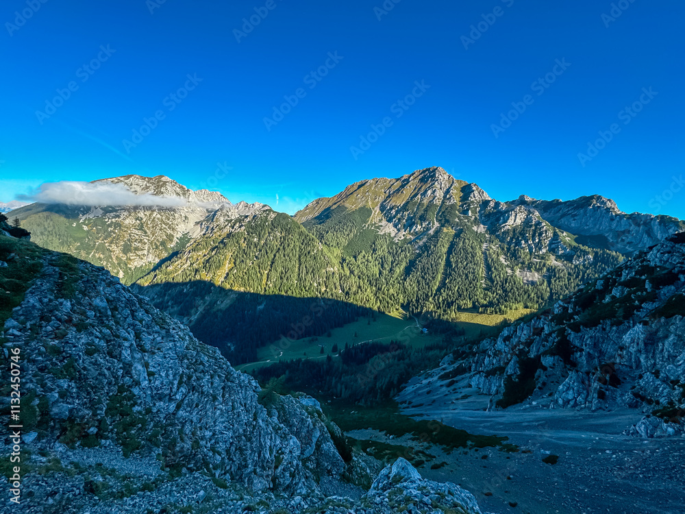 Obraz premium Scenic view of rugged mountain peak Wertatscha seen from Begunjscica, Loibl Pass in Karawanks, Slovenia Austria. Wanderlust in Austrian Slovenian Alps. Tranquil atmosphere in alpine wilderness. Hike