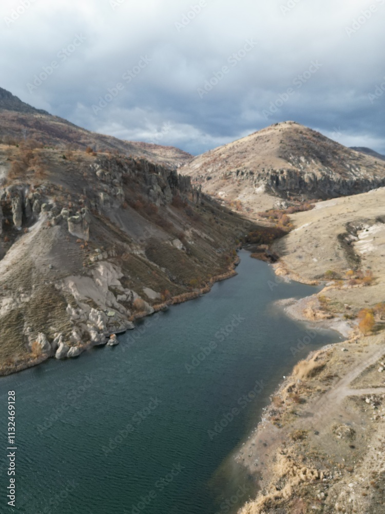 Fototapeta premium bare rocks river drone view autumn yellow