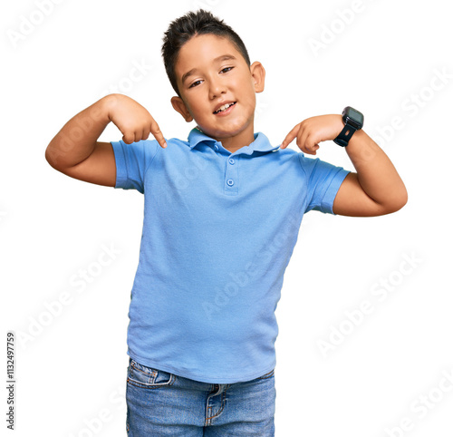 Little boy hispanic kid wearing casual clothes looking confident with smile on face, pointing oneself with fingers proud and happy. photo