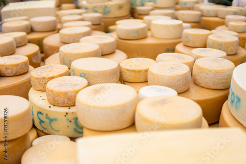 Piles of Swiss cow cheese heads collected during Desalpe festival in Lauterbrunnen, Switzerland