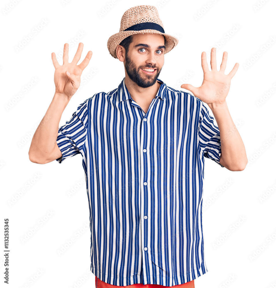 Φωτογραφία Young handsome man with beard wearing summer hat and striped shirt showing and pointing up with fingers number nine while smiling confident and happy