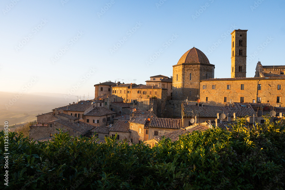 Fototapeta premium Panoramic view over Volterra at sunset. Iconic hilltop town in Tuscany, Italy
