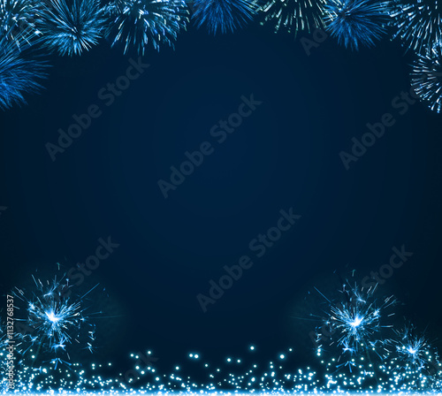 New Year fireworks in the blue night sky.