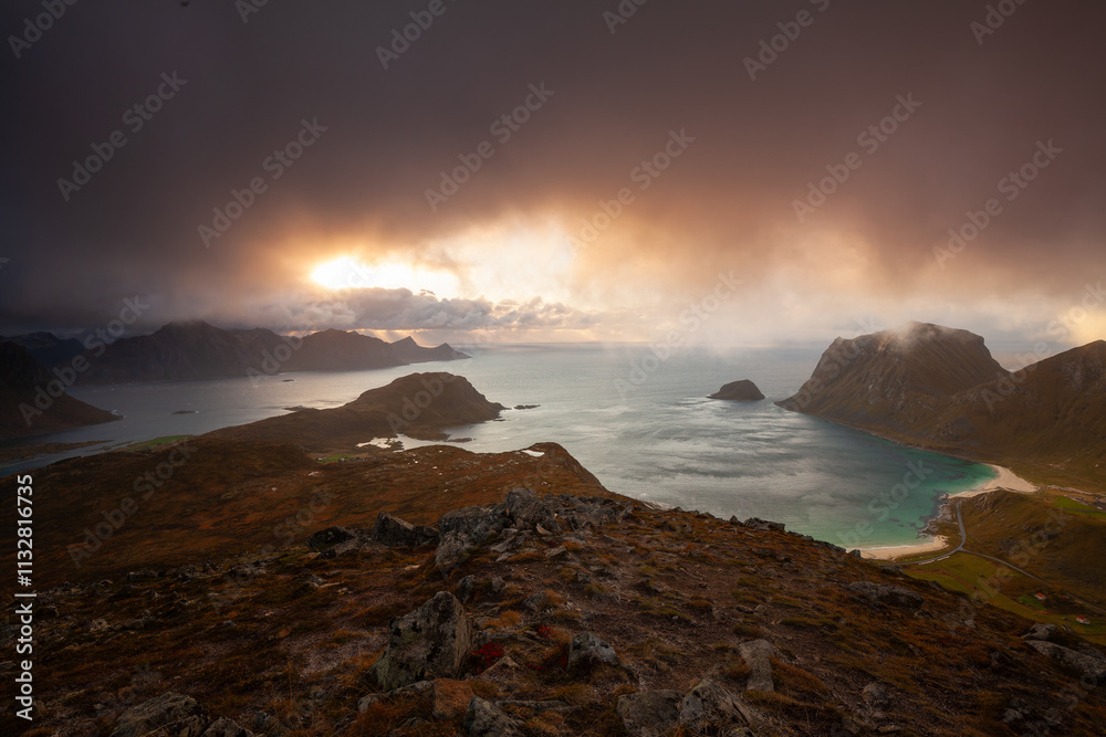 Obraz premium View of Haukland Beach and Vik Beach from the top of Holandsmelen, Lofoten. Dramatic sunset in autumn