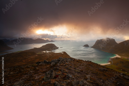 View of Haukland Beach and Vik Beach from the top of Holandsmelen, Lofoten. Dramatic sunset in autumn photo