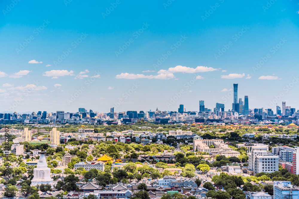Obraz premium High view scenery of Beijing International Trade CBD and White Pagoda Temple in Beijing, China