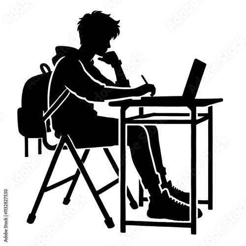 Silhouette of student studying at desk.
