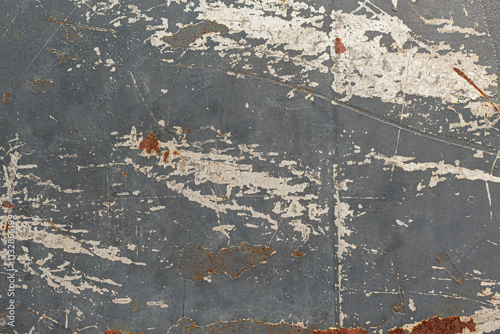 Old peeling paint on the wall as an abstract background.