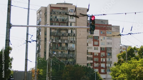 4K post-communism residential block with visible balconies, soviet-era architecture, urban cityscape, apartment building exterior, socialist architecture, post-socialist housing, vintage apartments photo