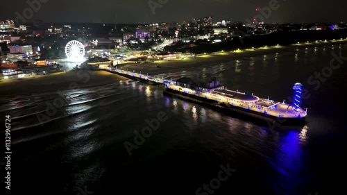 Orbiting Bournemouth pier and beach at night