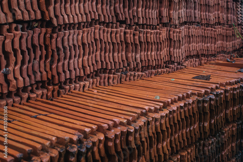 Stack of roof tiles on the floor, closeup of photo. photo