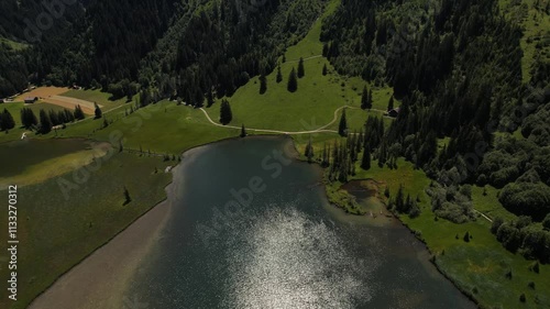 4K Aerial drone video of beautiful Alps mountain range in Lauenen on a sunny day. Wildhorn top with Lauenensee lake. photo