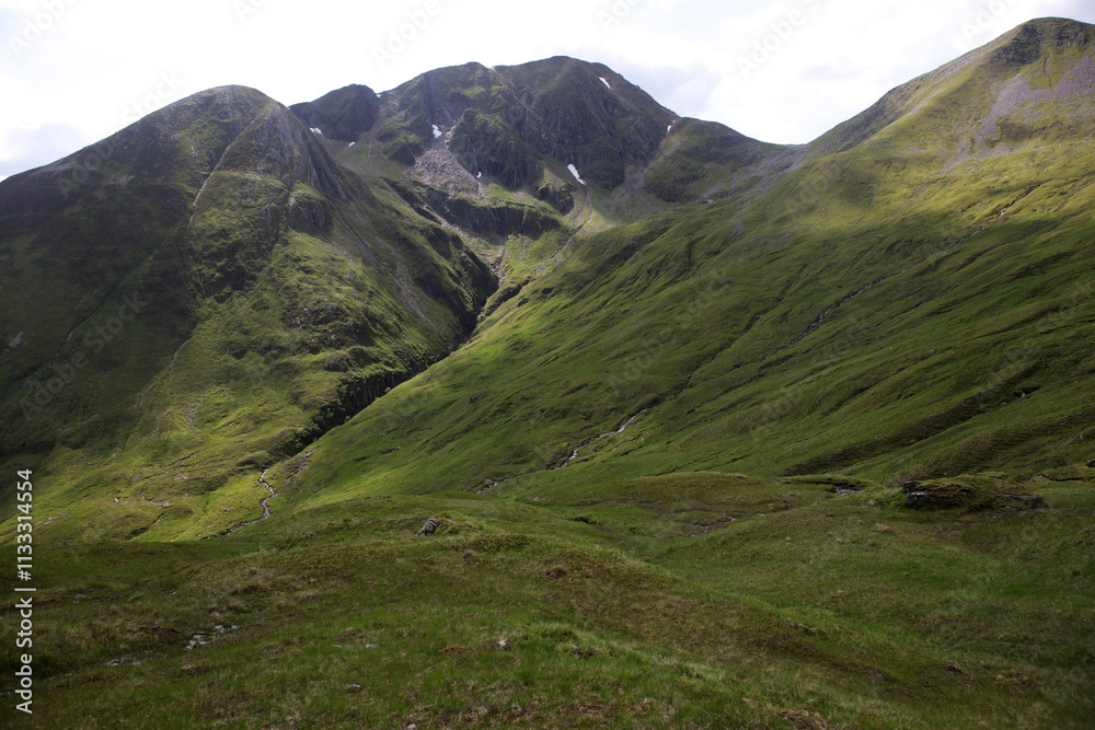 Fototapeta premium Ascent path to Binnein Mor and Na Gruagaichean - View towards Glen Nevis and water of Nevis valley - Mamores - Highlands - Scotland - UK