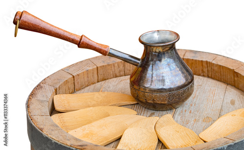 metal turk for coffee stands on a wooden barrel photo