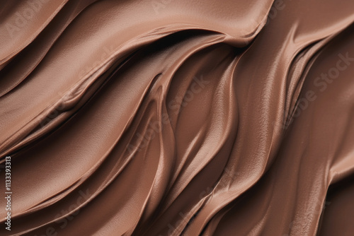 Close-up of silky flowing waves in rich mocha mousse tones, showcasing smooth textures and shine. Perfect for the 
