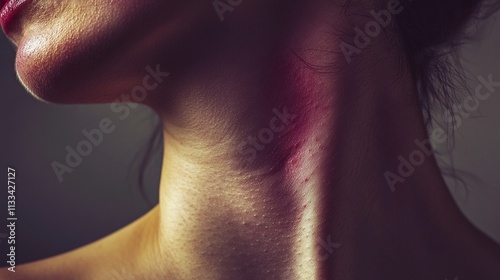 Close-up of a woman's neck with red marks.