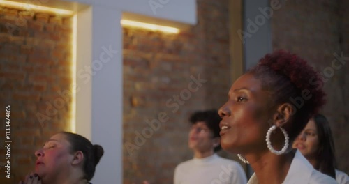 Woman passionately singing in worship, expressive and emotional connection to spirituality and faith, church congregation in prayerful unity with illuminated cross