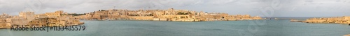 Obraz na płótnie Valletta (il-Belt Valletta) massive fortification city wall and Fort St. Angelo from harbour Xlokk South Eastern Region of Malta w salonie