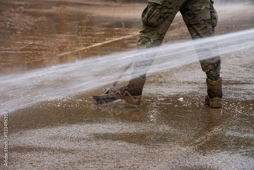 cleaning with pressurized water and brushes in the streets of the municipalities of Valencia affected by the floods, of Dana, to remove mud from the asphalt and sidewalks photo