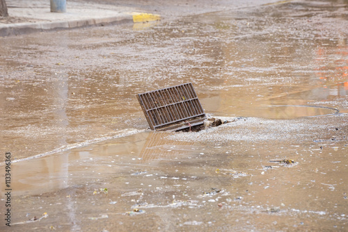 open scupper, on the street to swallow the mud from the road cleanings that are being carried out, in the municipalities affected by the damage of Valencia photo