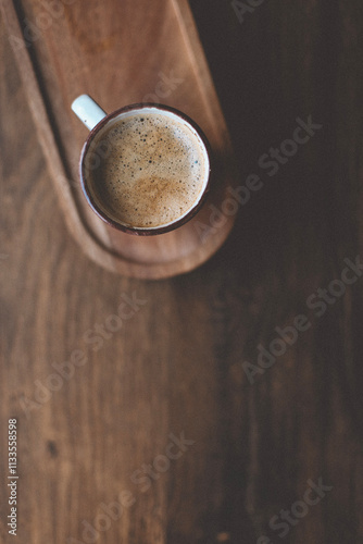 hot cup of coffee on wooden plate, flatlay, cozy autumn or winter holiday