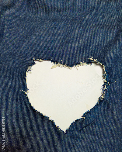 the heart forms an opening in the blue denim.