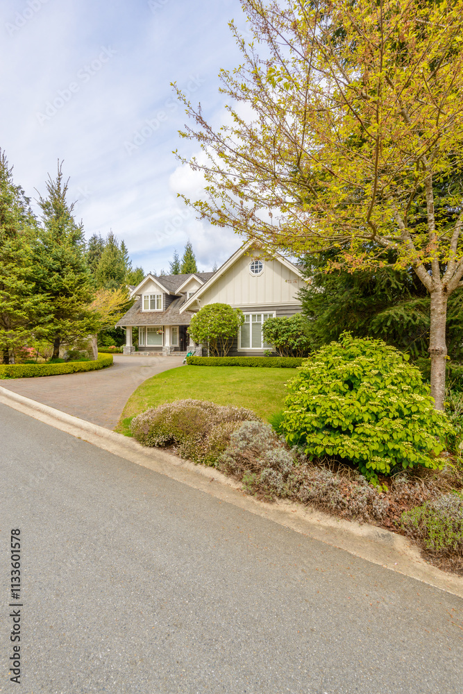 Two story luxury house with beautiful summer landscape in Vancouver, Canada, North America. Day time on June 2024. Two story luxury house with beautiful summer landscape in Vancouver, Canada, North America. Day time on June 2024.