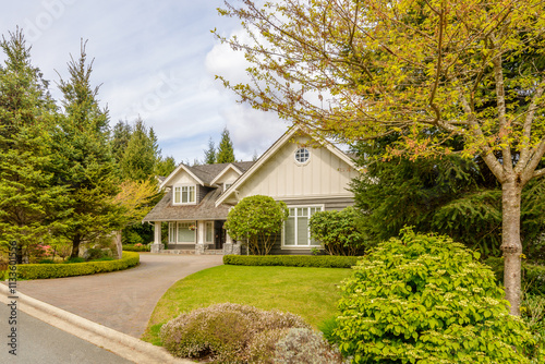 Two story luxury house with beautiful summer landscape in Vancouver, Canada, North America. Day time on June 2024.