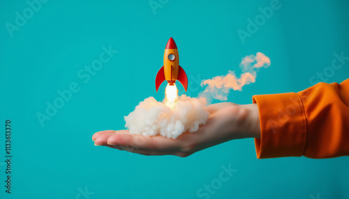 A hand presents a miniature rocket model, signifying innovation, ideas, and launching dreams. Highlighted on an aqua background, the dynamic image emphasizes creativity and exploring new horizons.

 photo