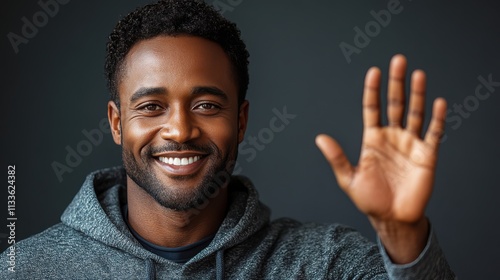 man smiling with sweatshirt in color background