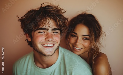 man smiling with sweatshirt in color background