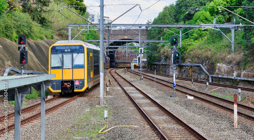 One Sydney suburban train arriving at Arncliffe Station and one departing